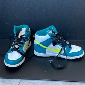 Nike Blue and White High-Top Sneakers with Bold Design